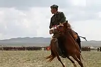 A Mongolian soldier performs during the opening ceremony for exercise Khaan Quest 2013 at the Five Hills Training Area in Mongolia, August 2013.