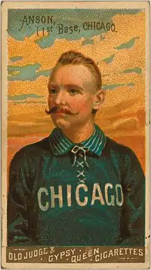Baseball card depicting a half-length portrait of a mustachioed man in a blue baseball uniform