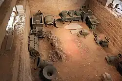 Tomb of Fu Hao, principal queen of the Shang dynasty in the 1200s BCE. Several human skeleton remains lay in the tomb's burial pit.