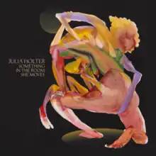 Two multi-coloured humanoid figures wrestling against a black background